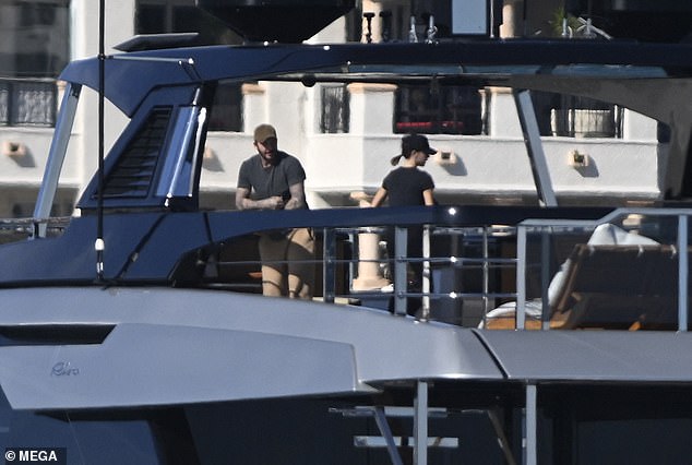 David and Victoria enjoyed a chat on the deck of the superyacht