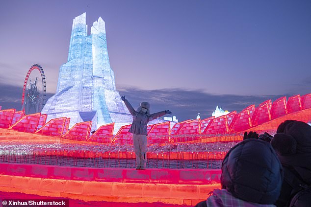 Tourists visit Harbin Ice and Snow World in Harbin, Heilongjiang Province, northeast China