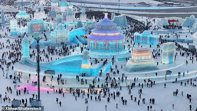 An aerial drone photo shows hundreds of visitors at the Harbin World Ice and Snow Festival.