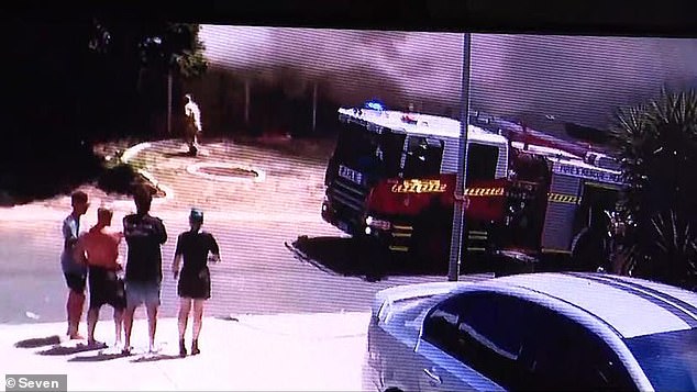 CCTV shows firefighters rushing into the house as the boy's shocked siblings and neighbors watch from the street.