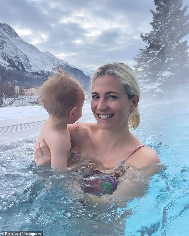 Making the most of the luxurious winter getaway, Pixie donned a colorful floral swimsuit as she swam with Albert in a heated outdoor pool.