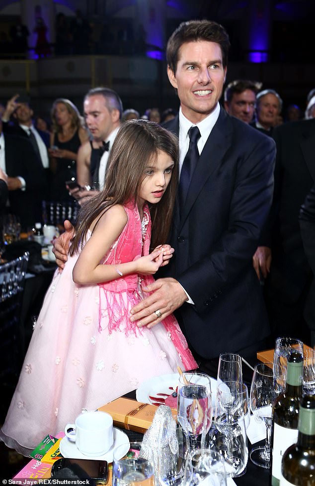 Suri has dropped the last name of her famous father, Tom Cruise, but he reportedly pays her $65,000 a year tuition, as well as medical, dental and insurance bills despite not being pictured with her since who ended his six-year marriage to Katie in 2012 (pictured).