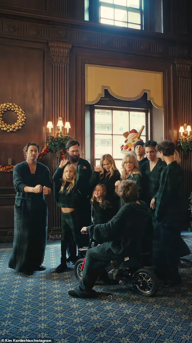 Filmed inside a luxurious mansion, the ad shows the Hudson-Hawn clan sporting SKIMS pajamas as they destroy a decadent Christmas meal served to them by a butler.