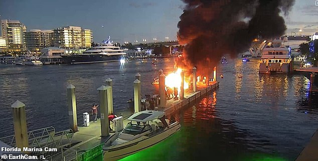 Pictured: More time passed and the two boats began to produce billowing clouds of black smoke