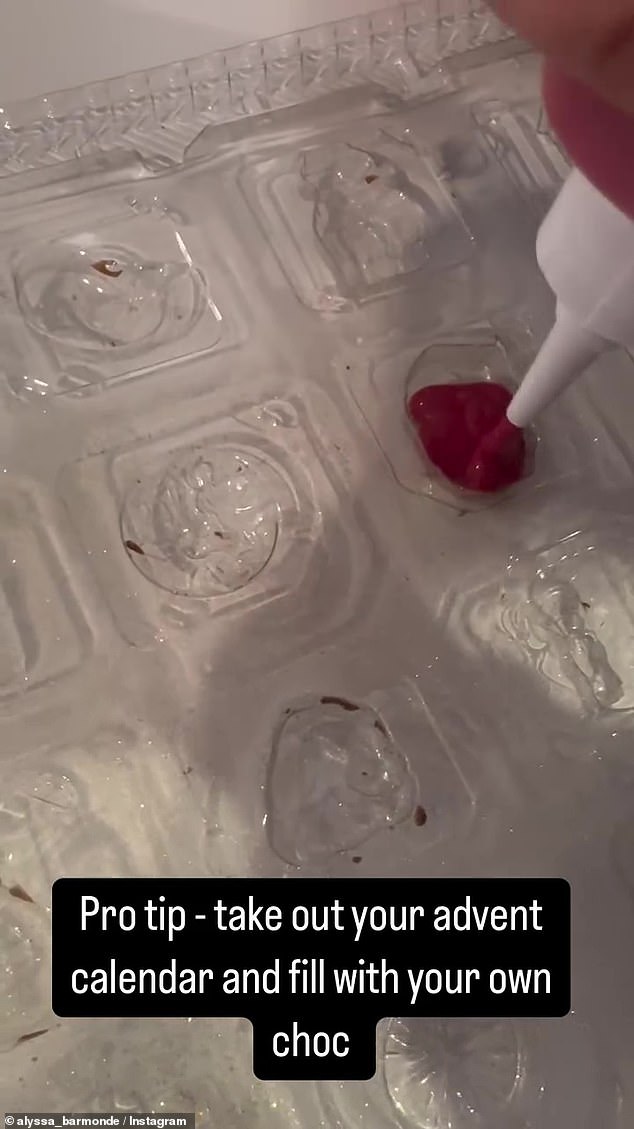 Alyssa filled the plastic tray of an empty advent calendar with homemade chocolate.