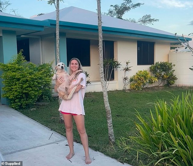 Samantha Royce bought a house in the village of Mele, outside Port Vila, and rescued an island dog (pictured)