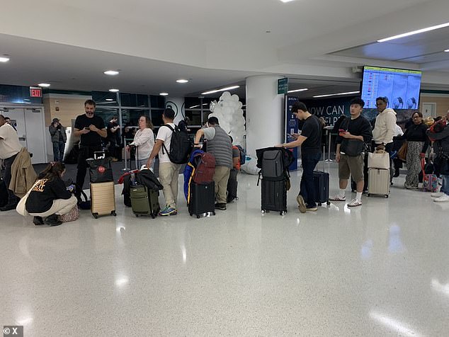 Pictured: Long lines Monday evening at a Delta gate at John F. Kennedy International Airport in New York City