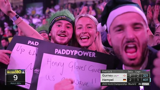 The England captain was in the crowd at Alexandra Palace for Monday night's darts action.