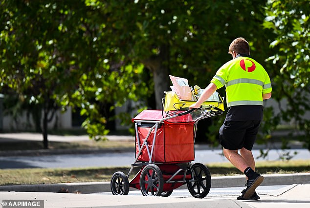 An Australia Post spokeswoman told Daily Mail Australia that the majority of parcels and parcels they handle are safely delivered to the intended recipient (pictured, an Australia Post worker delivering parcels).