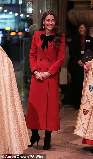 Kate donned a chic red Alexander McQueen coat with a statement black bow.