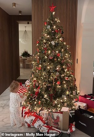 The mother-of-one also posted a clip of Bambi wearing her own festive pajamas and her standing under her stunning tree holding her Elf On The Shelf.