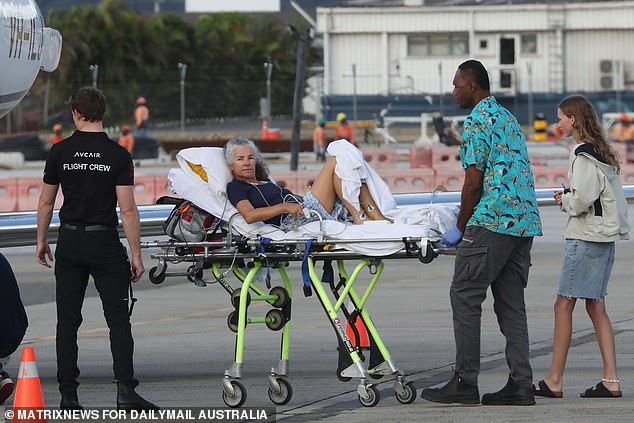 An Australian woman and her daughter are seen loaded into an air ambulance last week after being hospitalized in Fiji.