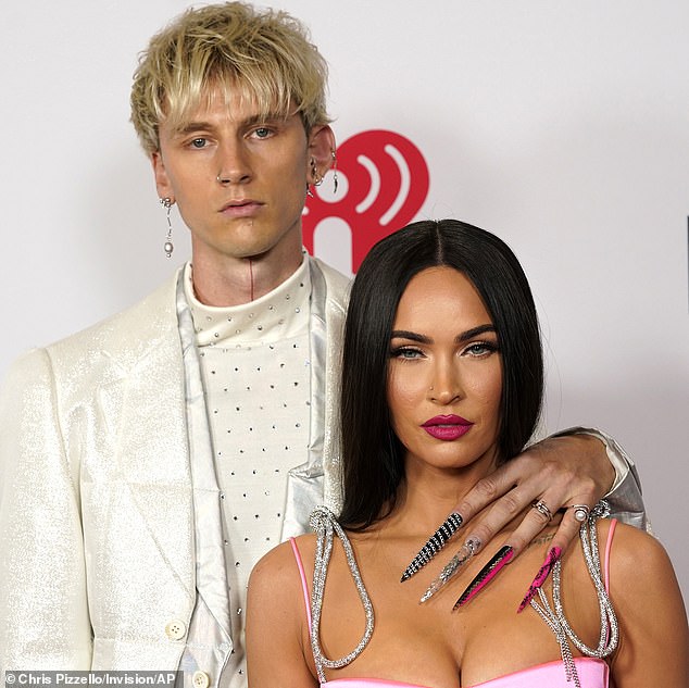 Megan (left) ended her relationship with Machine Gun (right), who is the father of her unborn child, over the Thanksgiving holiday amid accusations that he cheated (in 2021 at the IHeartRadio Awards)