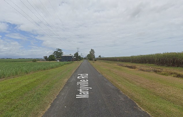 An off-duty police officer found the body on the side of Martyville Road (pictured) in Martyville, near Innisfail, about 5.20am on Wednesday.