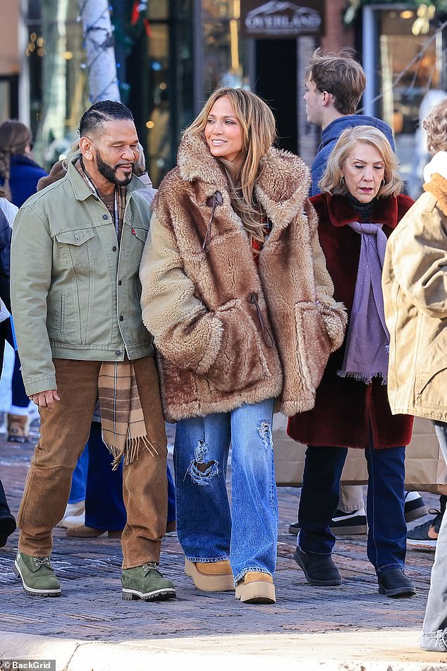 Their mother Guadalupe showed off her Christmas spirit in a fuzzy red coat, while manager Benny Medina sported a timeless olive Levi's trucker jacket.