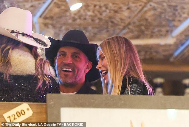 Meanwhile, Umansky was photographed kissing One Management model Klaudia K (R) at Matsuhisa in Aspen last Wednesday, with whom 