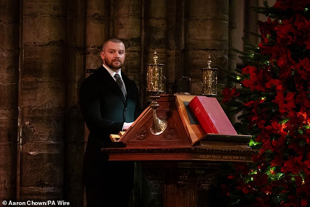 The service featured touching moments and brought together a host of celebrities to celebrate the festive season (pictured, Adam Peaty giving a reading).