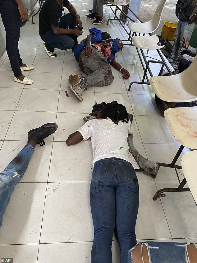 Journalists lie injured after being shot by armed gangs in the general hospital