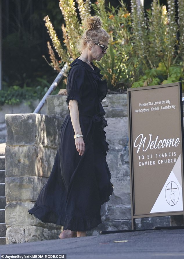 Nicole accessorized her summer ensemble with a variety of chunky jewelry as she arrived at church.