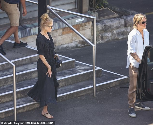 Keith looked equally dapper in a light blue shirt and beige chinos, which he teamed with a pair of black sneakers and aviator sunglasses.