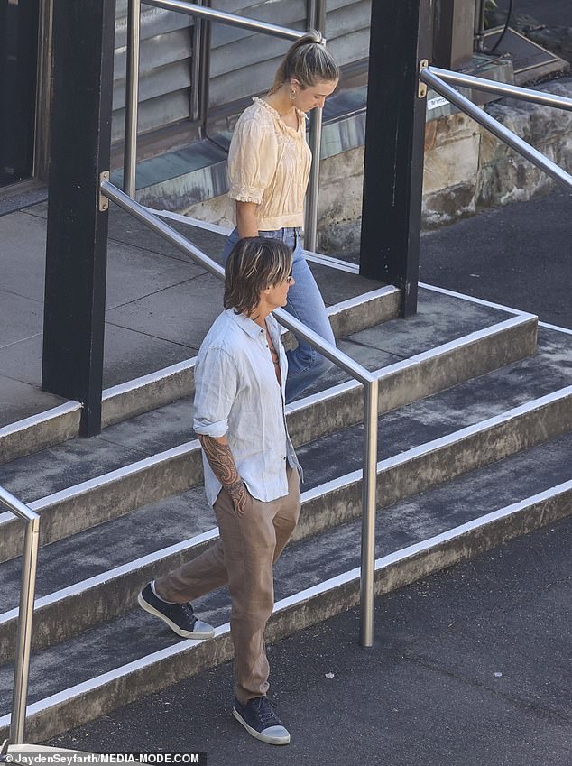 Sunday was wearing a yellow blouse and blue jeans when she left the church with Keith.