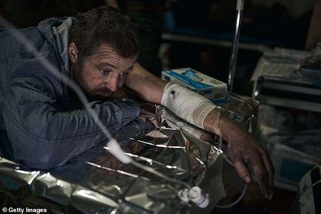 A patient receives first aid at a stabilization point on December 24, 2024 in Kupiansk, Ukraine.