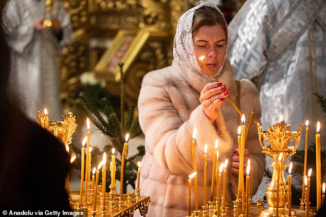 kyiv residents attend the Christmas service at St. Michael's Golden-Domed Monastery in kyiv, Ukraine, on December 24, 2024.