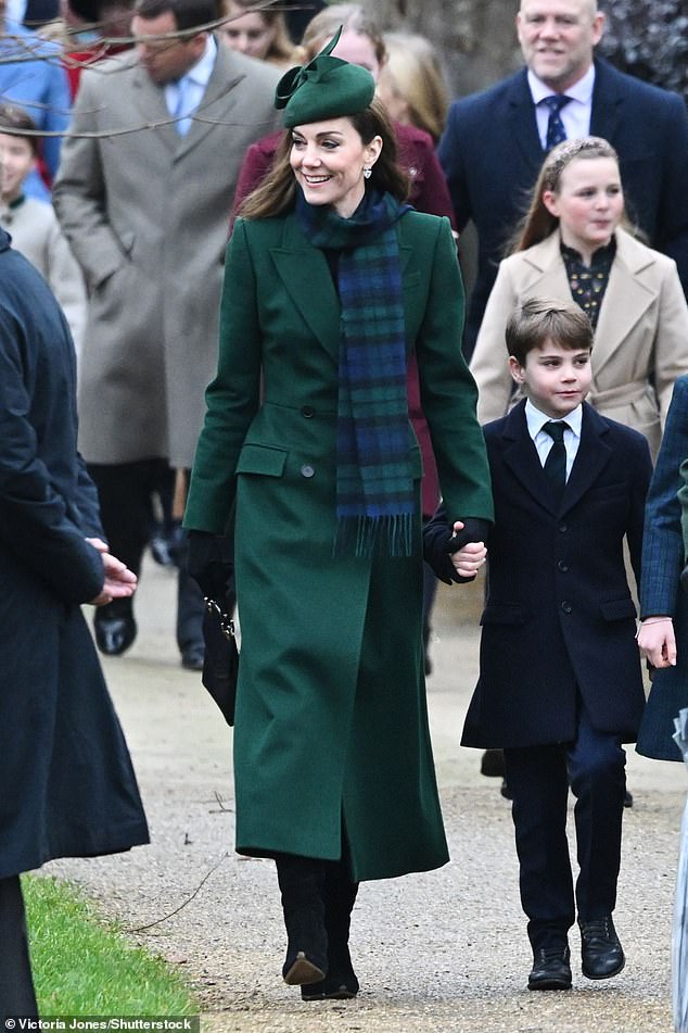 Prince Louis looked dapper in a navy blue coat and matching pants.