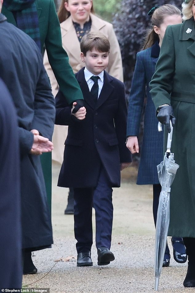 Prince Louis looked serious as he walked with his family.