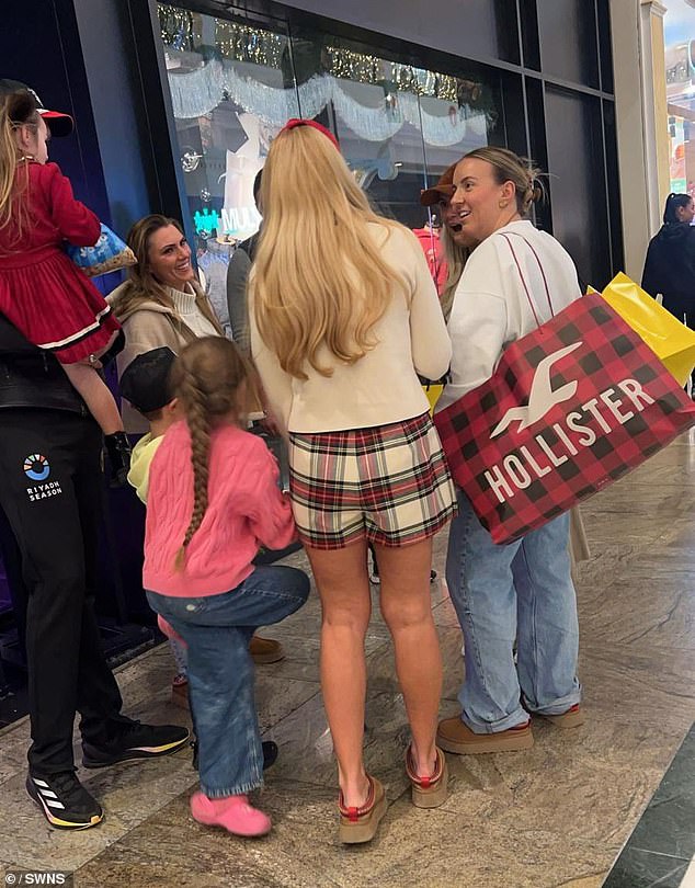 Molly-Mae, Tyson, 36, and Paris, 35, appeared to pass each other at the Trafford Center in Greater Manchester on Monday, along with Molly-Mae's sister Zoe (right).