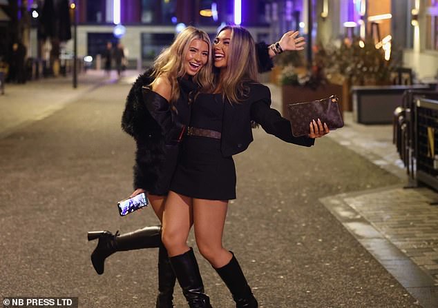 Two people in Leeds share a joke after braving the winter cold by donning matching outfits for the occasion