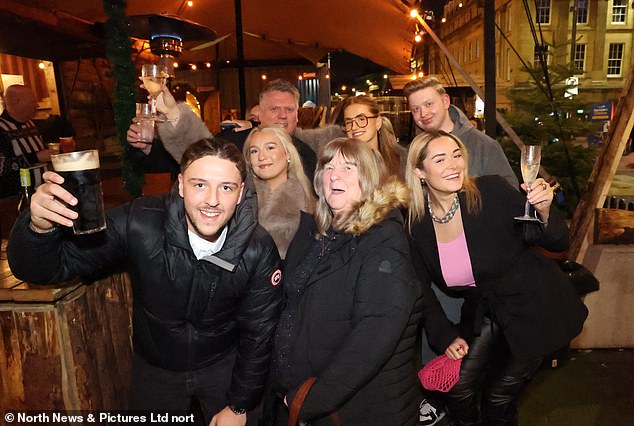 Drinkers in Newcastle also joined in the festivities, appearing in good spirits as they toasted the camera