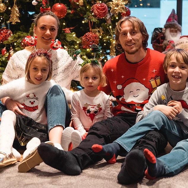 Luka Modric put on a Christmas sweater sitting next to his partner and three children.