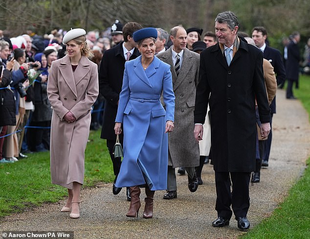 Sophie paired her coat with a netted pillbox hat in a deeper shade of blue.