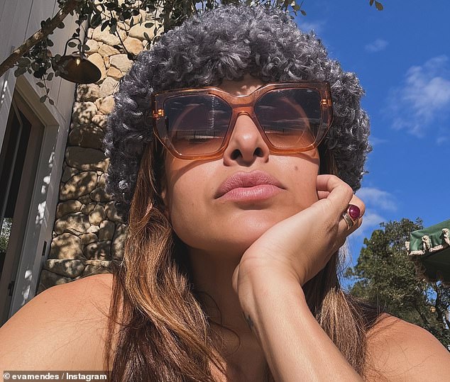 Eva Mendes, who has been with Ryan Gosling for 13 years, enjoyed 'A Very Californian Christmas', sitting outside and soaking up the sun.