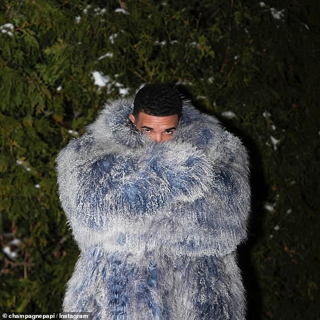 Drake wrapped himself in an extravagant blue and white coat, possibly made of faux fur, and boasted: 