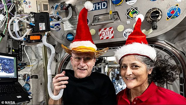 Many on social media wondered how the stranded astronauts got the Christmas decorations they showed in their holiday video. Williams is pictured with astronaut Don Pettit