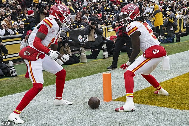 Xavier Worthy (1) celebrates his touchdown with Hollywood Brown (5) with a pantomime