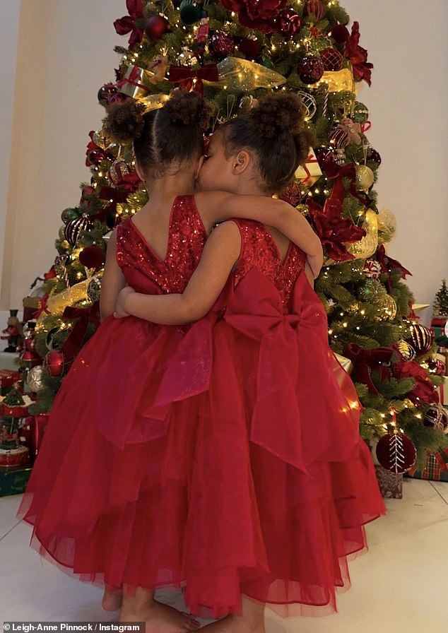 The Little Mix alum took to her Instagram page with some heartwarming snaps of the two little ones cuddling in beautiful red dresses.