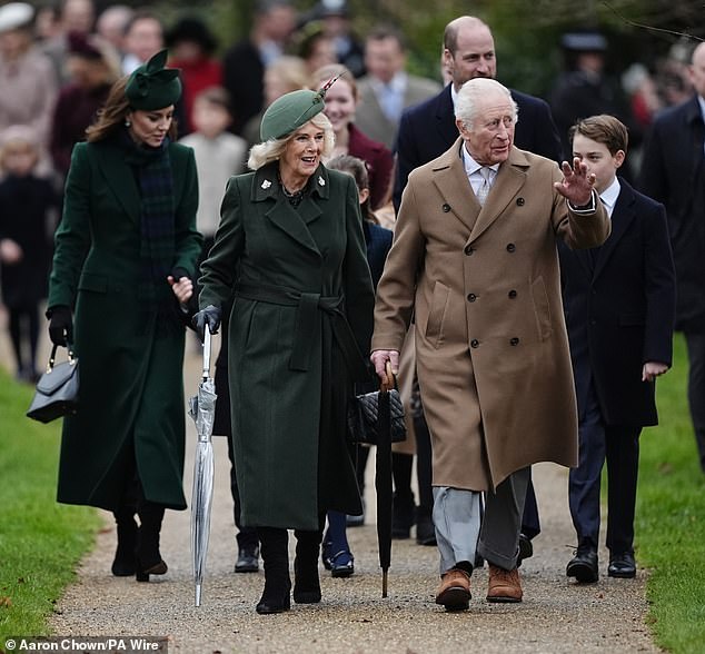 Charles greeted the spectators while Catherine held the hand of her Prince Louis, her youngest son.