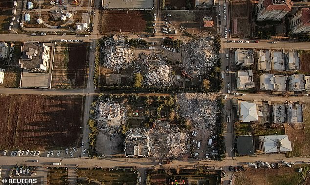 An aerial photo shows residential buildings destroyed by a deadly earthquake in Adiyaman, Turkey