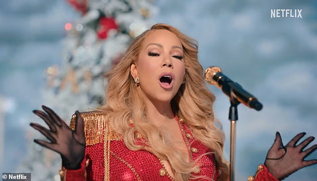 1735171659 713 Mariah Carey stuns as she performs her Christmas classic All