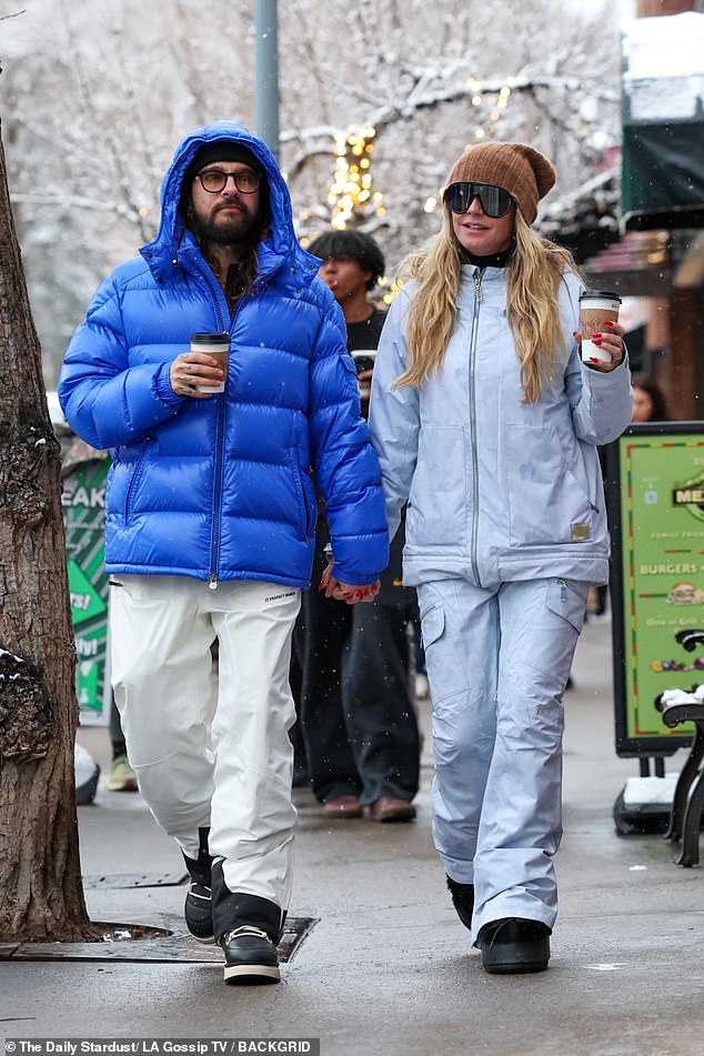 The 35-year-old guitarist wore a blue puffer jacket and white snow pants as the duo enjoyed the luxury getaway.