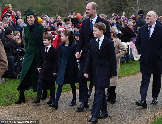 William walked hand in hand with Charlotte and Kate, who was wearing a green coat and hat, smiled at the crowd.