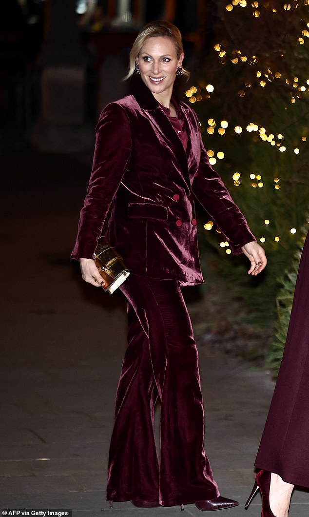 Zara clearly enjoyed the royal fashion memo, wearing a burgundy velvet pantsuit, along with matching heels and a gold bag.