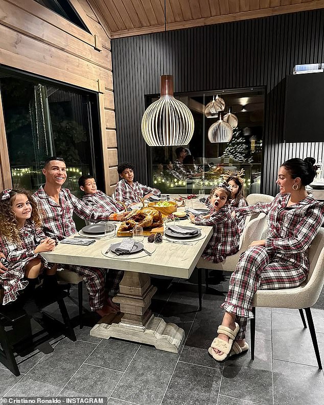 Cristiano Ronaldo pictured with his girlfriend Georgina Rodríguez, 30, and their children Cristiano Ronaldo Jr, 14, Alana Martina, eight, twins Eva María and Mateo, seven, and Bella, two.