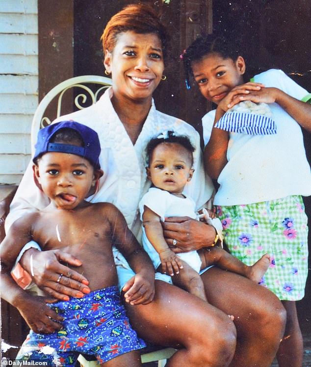 Shanon posed for a family photo with little Simone on her knee next to her two older children, Tevin and Ashley