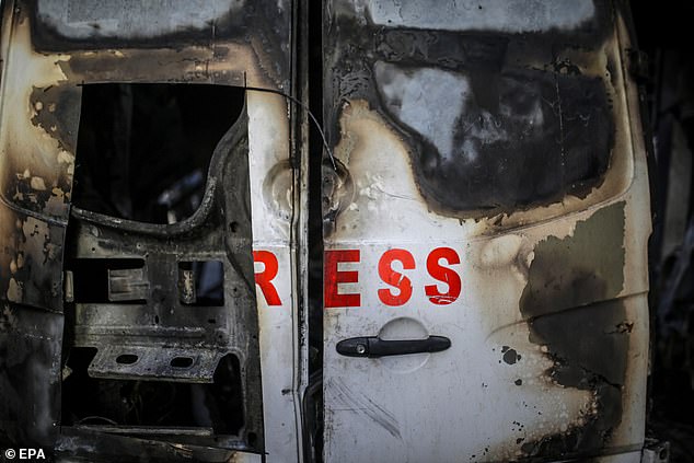 A destroyed vehicle near Al Awda Hospital after an Israeli airstrike in the Al Nuseirat refugee camp, central Gaza Strip, December 26, 2024