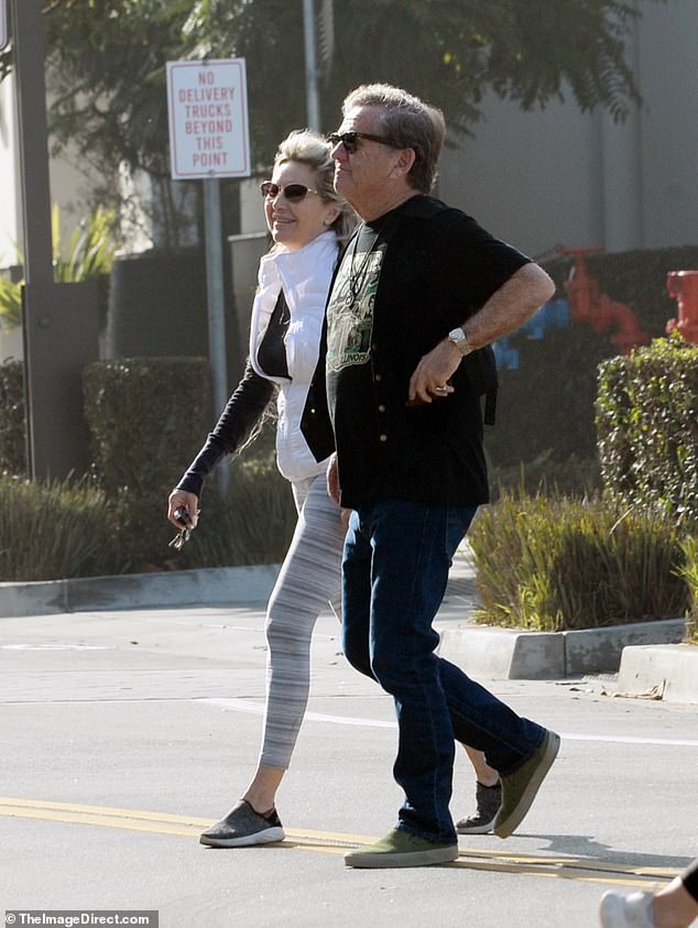 The actor, who is rarely seen in public, was photographed with a female companion doing some last-minute Christmas shopping in Los Angeles on Monday.