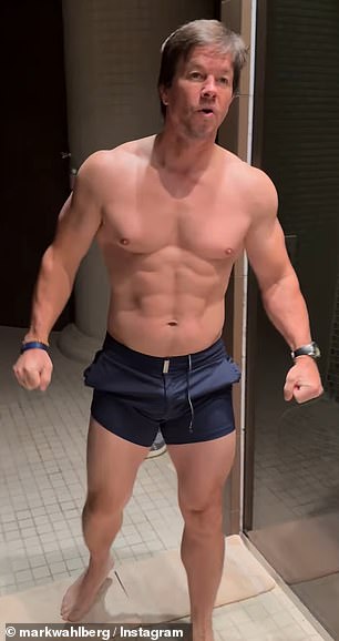 The 53-year-old actor flexed his chiseled chest, six-pack abs and muscular arms while wearing nothing but dark shorts as he prepared to take a cold plunge.